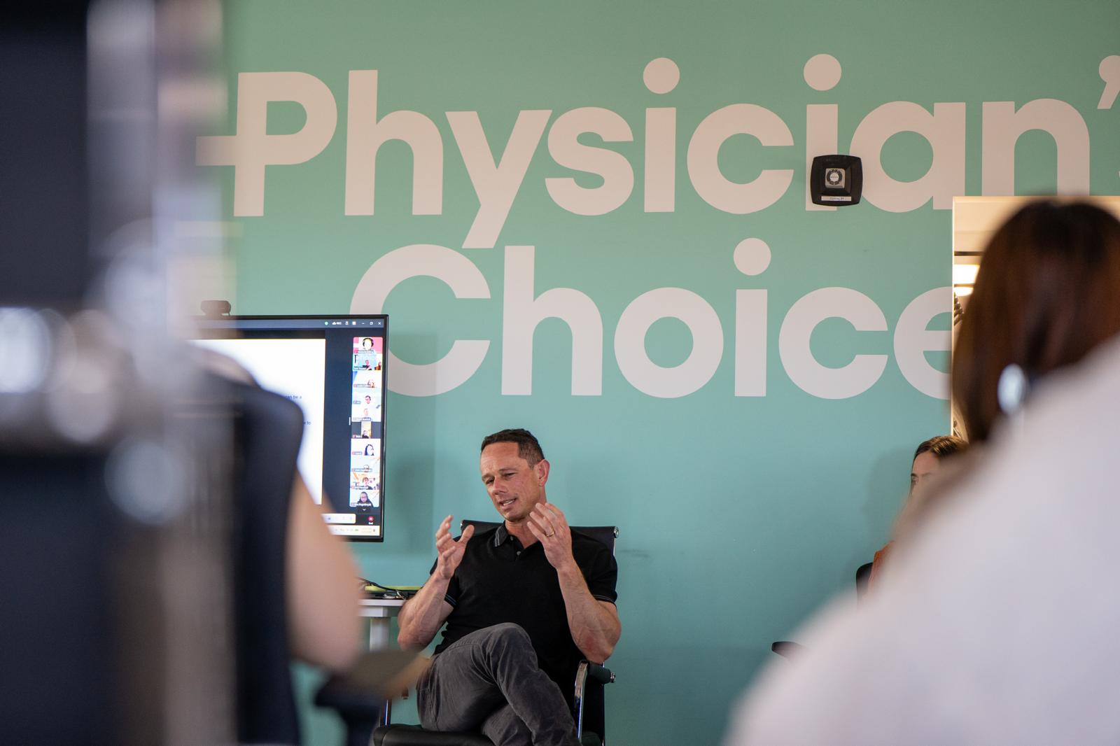 Logan Chierotti holding Physician's Choice product at Walmart